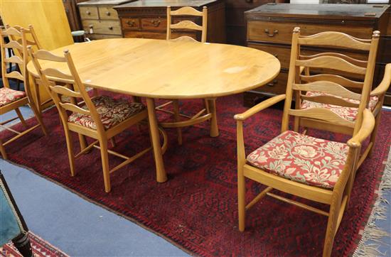 An Ercol table and six chairs, table W.214cm fully extended
